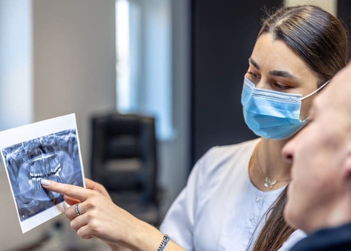 Iranian dentist explaining for patient