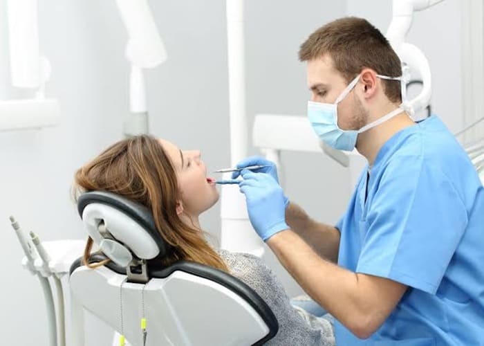 visiting dentist for signs of tooth decay