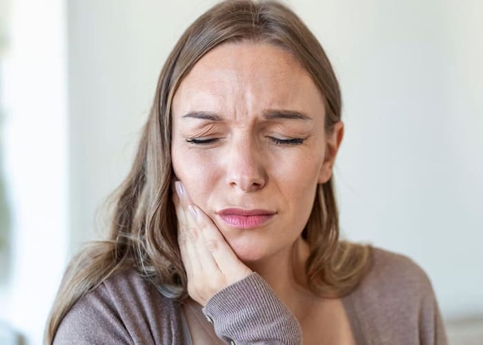 woman with tooth pain